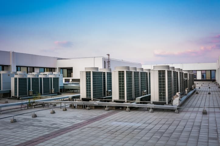 Commercial rooftop HVAC units installed on a large building