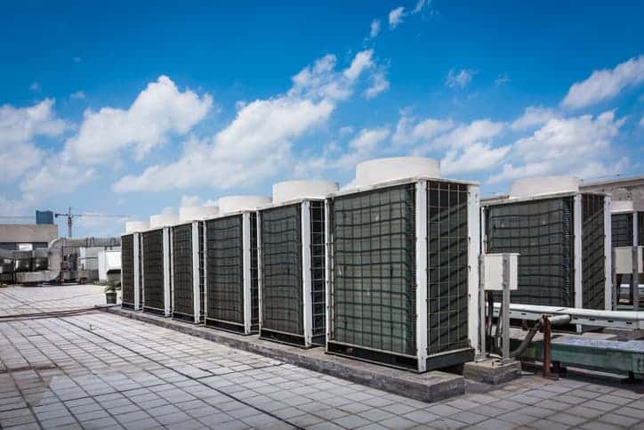 Commercial rooftop air conditioning units installed on an industrial building